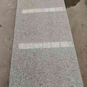 张掖芝麻白光面毛板